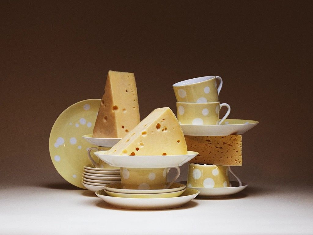 Yellow polka-dot porcelain and Swiss cheese from the Svenska Ostklassiker collection by Gustafsberg.