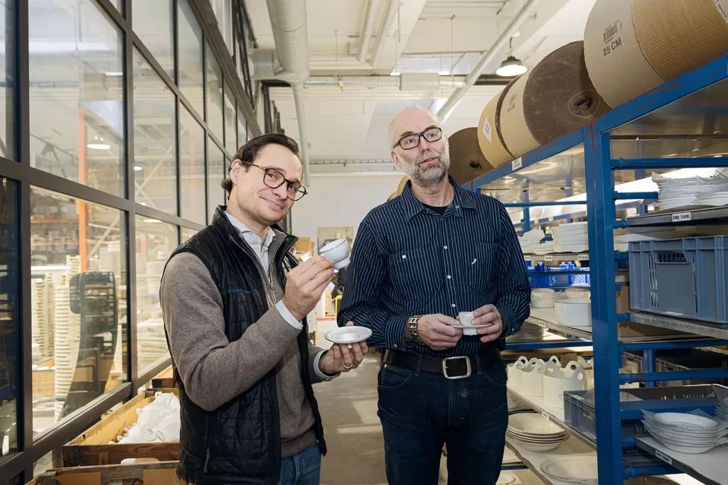 Oryx Capital and Gustafsberg Porcelain Factory leadership with porcelain cups in the factory.